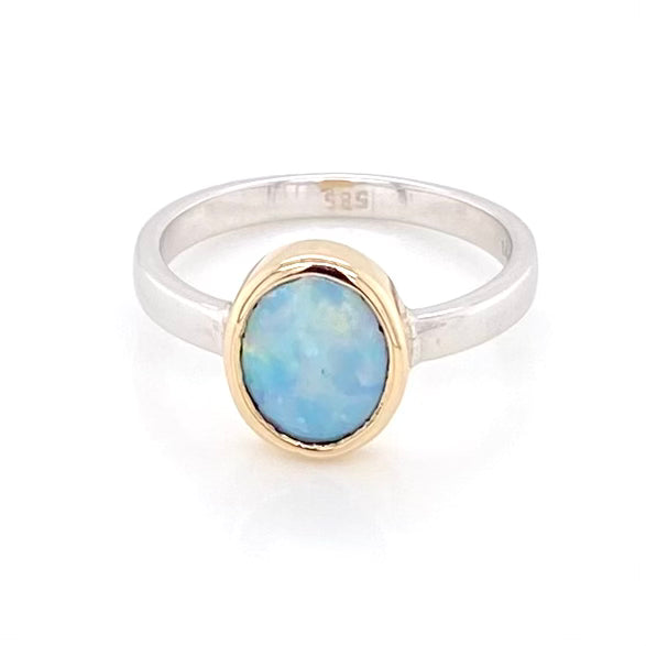 Ægte solid krystal opal fra Australien indfattet i 14 kt. guld og sterling sølv.