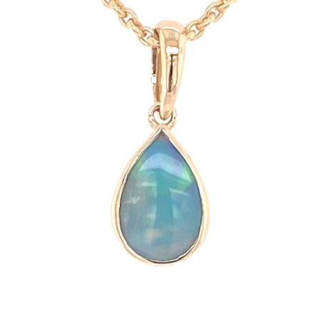 Vedhæng med en ægte solid krystal opal fra Australien indfattet i 14 karat guld.