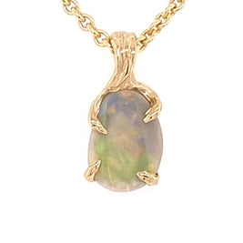 Ægte solid krystal opal fra vores egen mine i Lightning Ridge, Australien indfattet i 14 karat rustikt guld. De krogede grene af 14 karat guld holder opalen på plads.