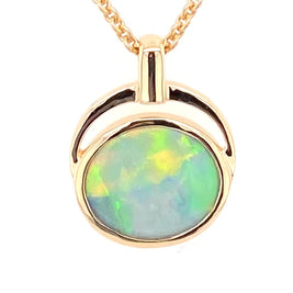 Vedhæng med en ægte solid krystal opal fra Australien indfattet i 14 karat guld. Opalen vejer 1,18 ct.