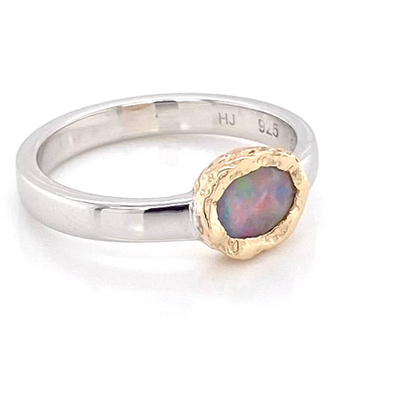 Ægte solid crystal opal fra Australien indfattet i 14 karat guld og sterling sølv.